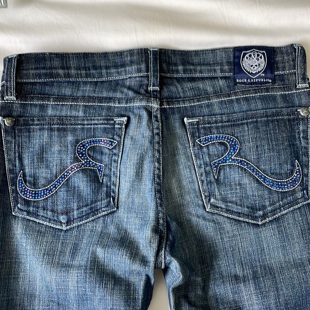 ROCK & REPUBLIC low-rise jeans with bejeweled logo pockets and boot cut leg US27